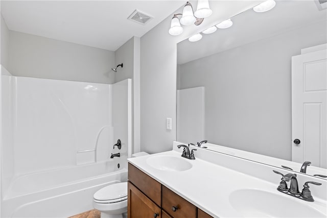 full bathroom featuring toilet, vanity, and  shower combination