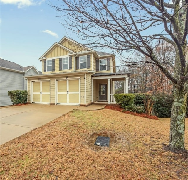 view of front of property with a garage and covered porch