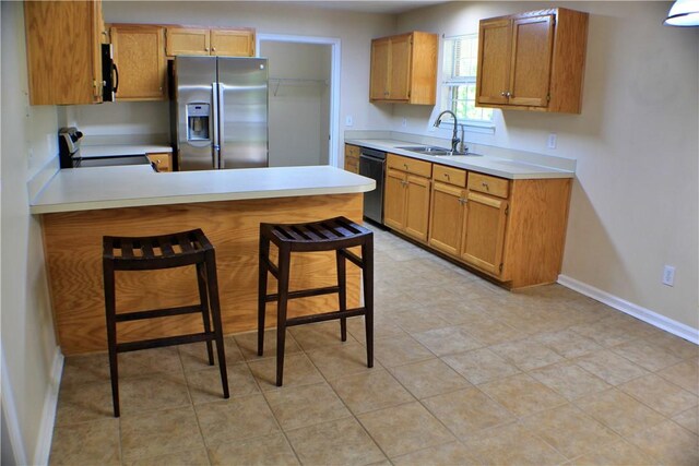 50 Cricket Rdg, Tallassee, AL 36078 - kitchen with stainless steel fridge, dishwasher, a sink, a peninsula, and light countertops