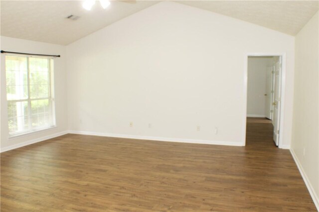 50 Cricket Rdg, Tallassee, AL 36078 - empty room with vaulted ceiling, dark wood-type flooring, and baseboards