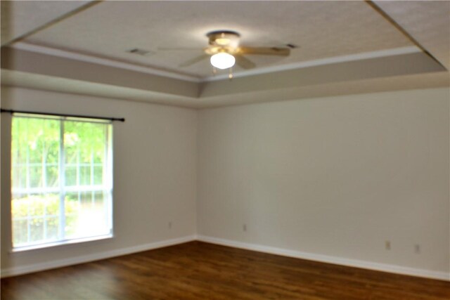 50 Cricket Rdg, Tallassee, AL 36078 - empty room with a tray ceiling, wood finished floors, baseboards, and a ceiling fan