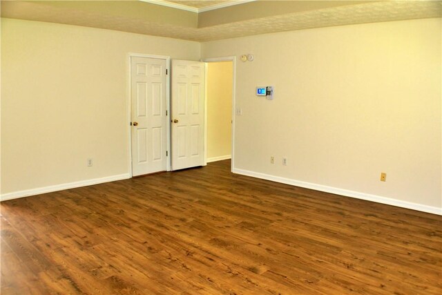 50 Cricket Rdg, Tallassee, AL 36078 - empty room featuring ornamental molding, baseboards, and dark wood-style flooring