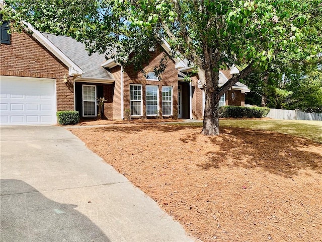 3672 Hawthorne Ct, Auburn, AL 36830 - view of front of property featuring brick siding, driveway, roof with shingles, and an attached garage