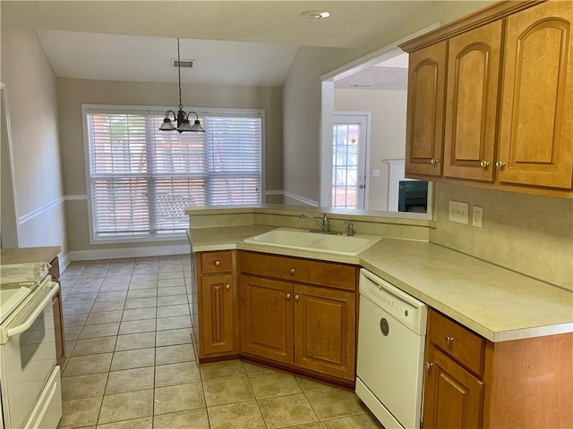 3672 Hawthorne Ct, Auburn, AL 36830 - kitchen featuring white appliances, brown cabinets, light tile patterned floors, and light countertops