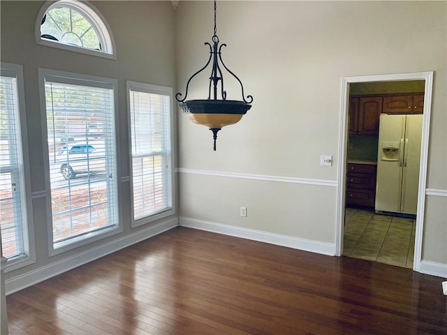 3672 Hawthorne Ct, Auburn, AL 36830 - unfurnished dining area featuring hardwood / wood-style flooring and a towering ceiling