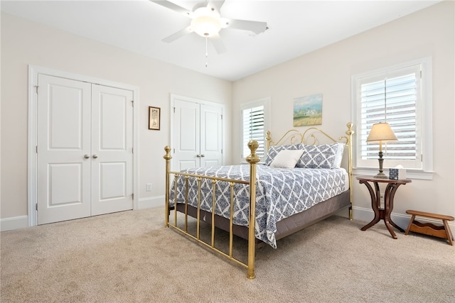 554 Arbor Dr, Auburn, AL 36830 - bedroom with two closets, carpet flooring, and a ceiling fan