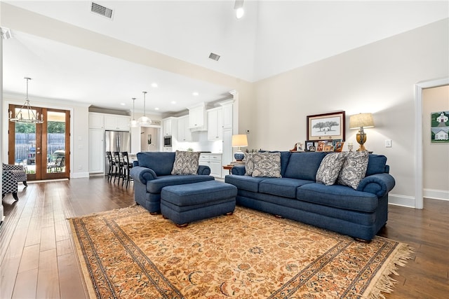554 Arbor Dr, Auburn, AL 36830 - living room featuring dark wood-style floors, a chandelier, ornamental molding, and recessed lighting