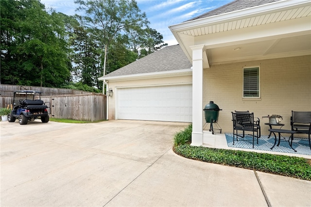 554 Arbor Dr, Auburn, AL 36830 - view of patio with concrete driveway and an attached garage