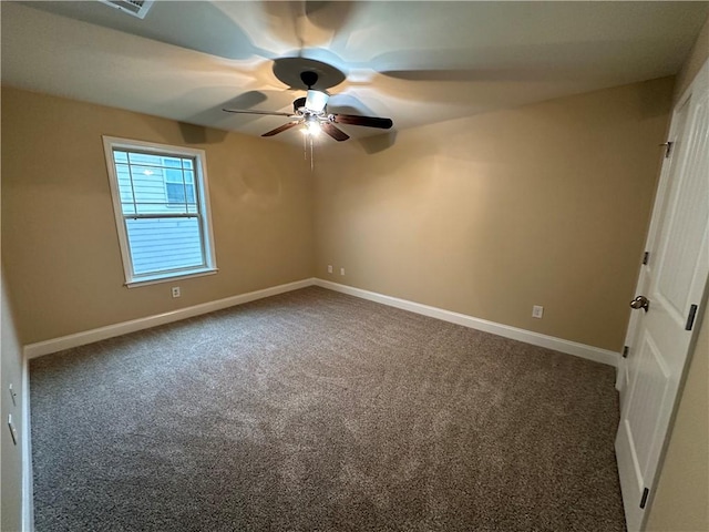 carpeted empty room featuring ceiling fan