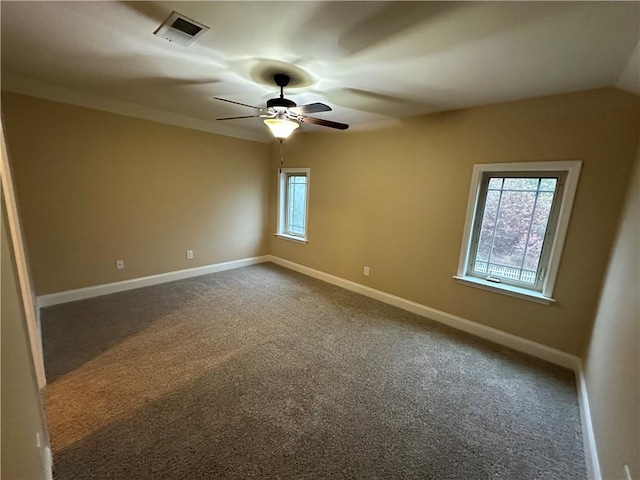 spare room featuring carpet and ceiling fan