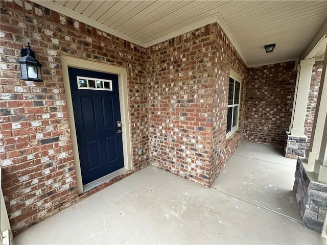 entrance to property featuring a porch