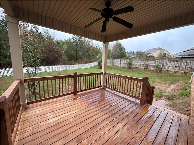 deck with ceiling fan and a yard