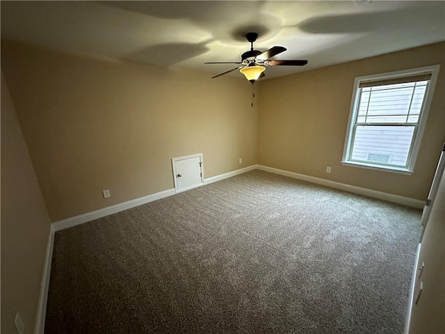 unfurnished room featuring ceiling fan and carpet