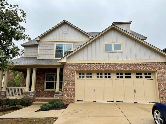 craftsman-style home with covered porch and a garage