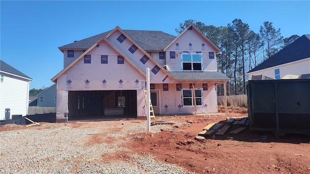 property under construction with driveway and an attached garage