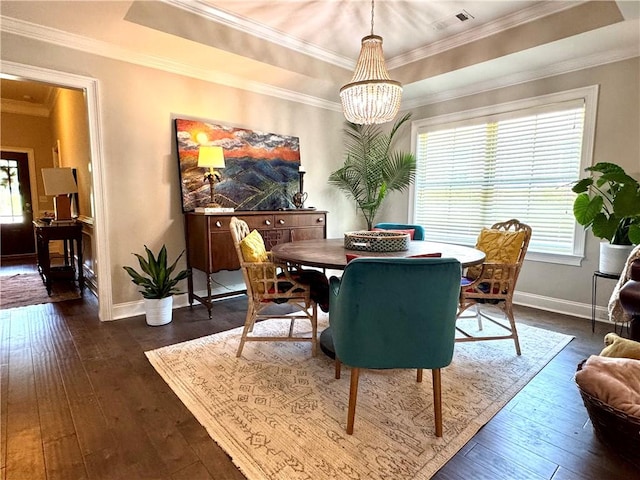 2457 Snowshill Ln, Auburn, AL 36832 - dining room with plenty of natural light, a chandelier, dark wood-style floors, baseboards, and ornamental molding