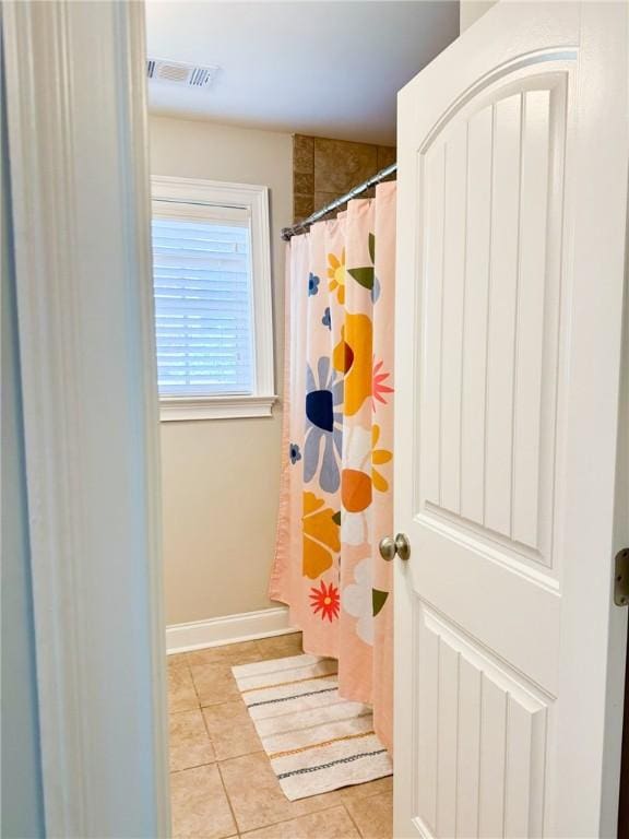2457 Snowshill Ln, Auburn, AL 36832 - bathroom featuring tile patterned flooring, a shower with curtain, and baseboards