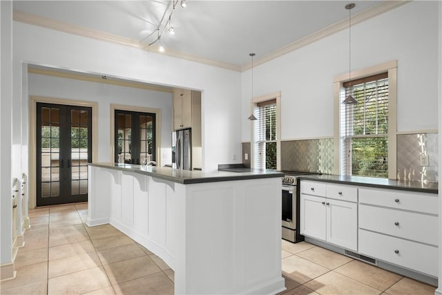 kitchen featuring french doors, stainless steel appliances, white cabinets, pendant lighting, and light tile patterned flooring