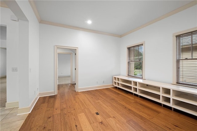 interior space featuring light hardwood / wood-style flooring and crown molding