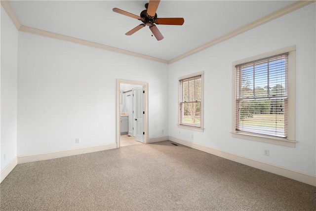 carpeted empty room with crown molding and ceiling fan