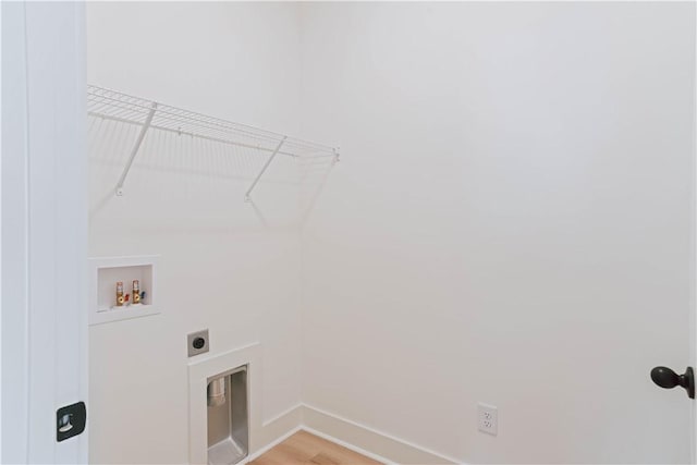 laundry area with baseboards, light wood-style floors, electric dryer hookup, laundry area, and washer hookup
