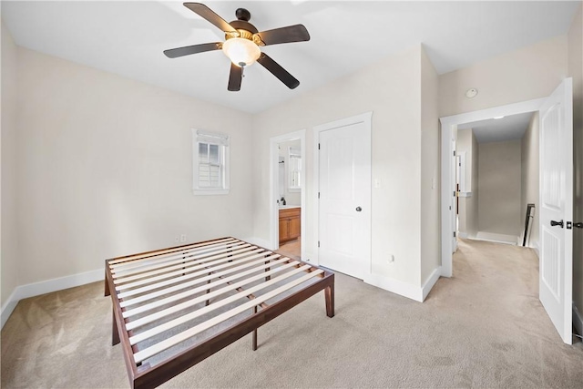 650 Dekalb St Unit 1130, Auburn, AL 36830 - unfurnished bedroom featuring light colored carpet, ensuite bathroom, and a ceiling fan
