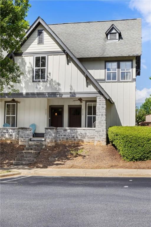 650 Dekalb St Unit 1130, Auburn, AL 36830 - view of front of home featuring board and batten siding, stone siding, a porch, and roof with shingles