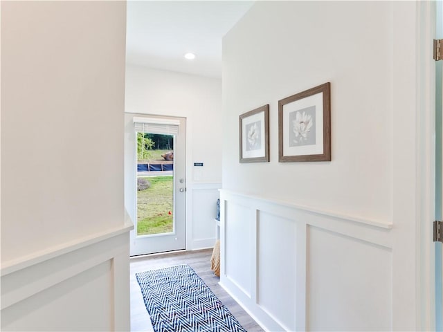 1062 Hunters Way, Opelika, AL 36801 - entryway featuring light wood-style flooring, wainscoting, and a decorative wall
