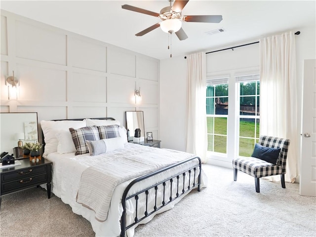 1062 Hunters Way, Opelika, AL 36801 - bedroom with a decorative wall, carpet, and ceiling fan