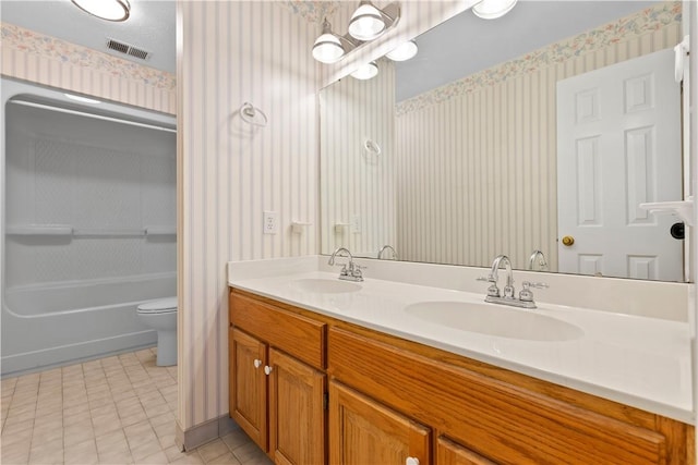 full bathroom with shower / tub combination, vanity, and toilet