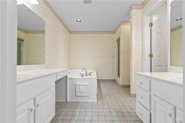 bathroom featuring plus walk in shower, vanity, and tile patterned floors