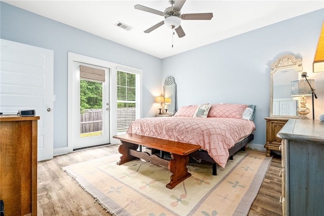 1242 Burrow Cir, Opelika, AL 36801 - bedroom with access to exterior, light wood finished floors, ceiling fan, and baseboards