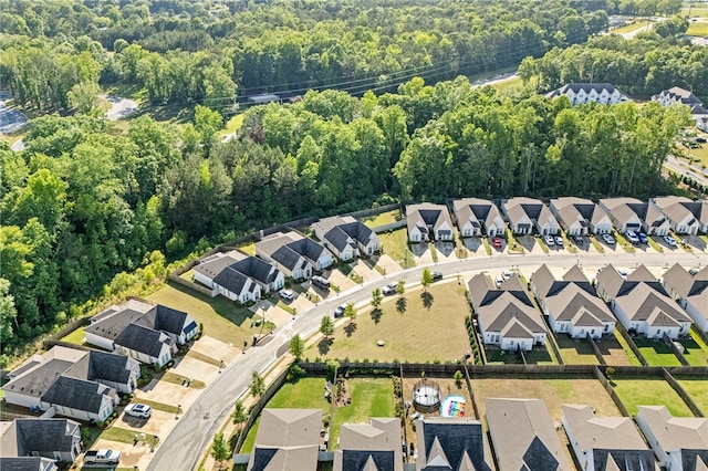 1242 Burrow Cir, Opelika, AL 36801 - aerial view of property and surrounding area with nearby suburban area and a forest
