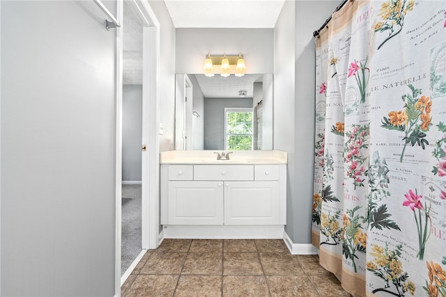 bathroom featuring vanity, baseboards, and a shower with curtain
