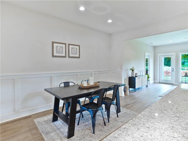 1003 Crossing Ct E, Valley, AL 36854 - dining room featuring a decorative wall, light wood-style floors, wainscoting, and recessed lighting