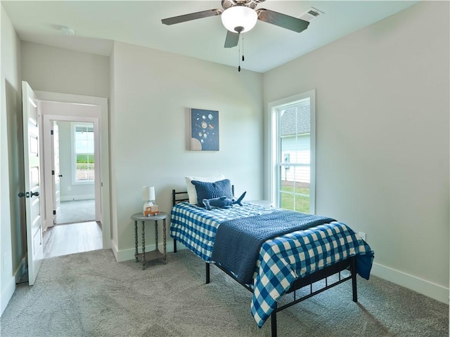 1003 Crossing Ct E, Valley, AL 36854 - carpeted bedroom featuring baseboards and ceiling fan