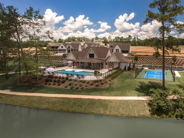 view of pool with a fenced in pool, a yard, a patio, and fence