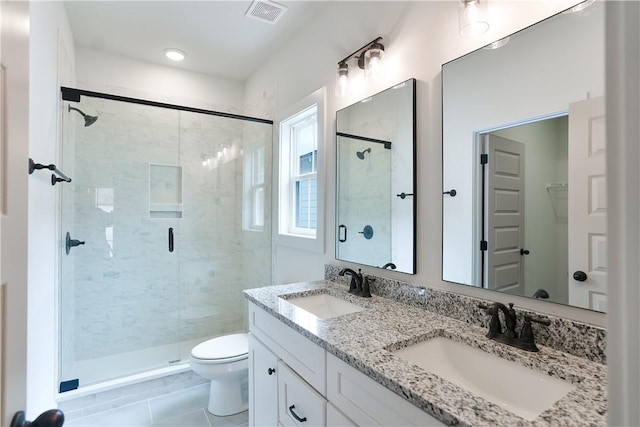 full bathroom with a sink, visible vents, toilet, and a shower stall