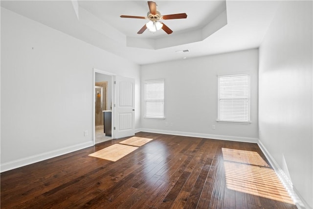 2711 Tara Ct, Opelika, AL 36804 - empty room featuring a raised ceiling, ceiling fan, and hardwood / wood-style floors