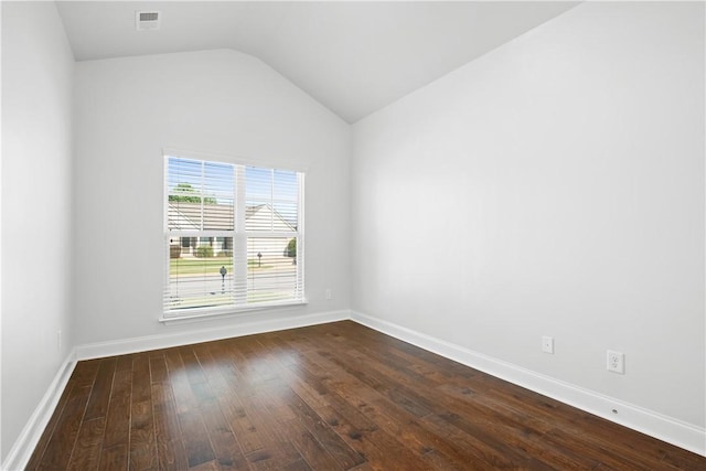 2711 Tara Ct, Opelika, AL 36804 - spare room featuring dark wood-style flooring and lofted ceiling