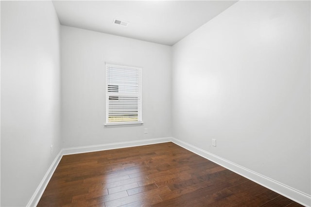 2711 Tara Ct, Opelika, AL 36804 - empty room featuring dark wood-style flooring and baseboards