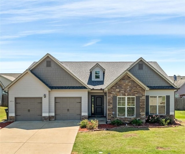 2711 Tara Ct, Opelika, AL 36804 - craftsman inspired home featuring stone siding, driveway, a garage, and roof with shingles