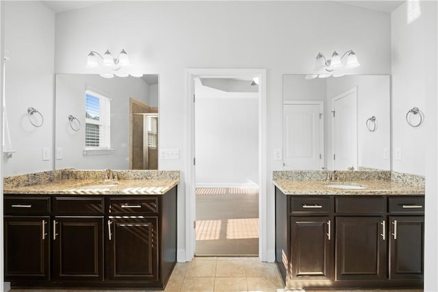 2711 Tara Ct, Opelika, AL 36804 - full bathroom with tile patterned flooring, two vanities, and a shower stall