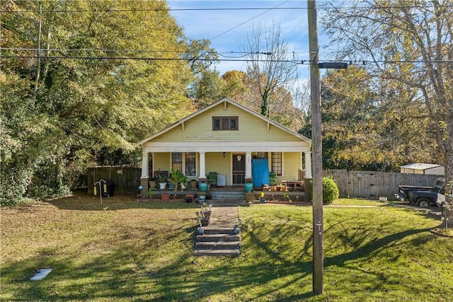 bungalow-style house with a porch and a front yard