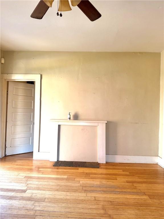 empty room with light hardwood / wood-style flooring