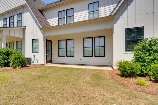 617 Cameron Ct, Auburn, AL 36830 - back of property with board and batten siding, a shingled roof, a lawn, and cooling unit