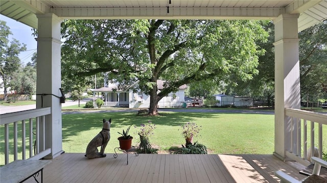 wooden deck with a yard