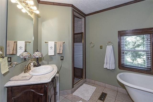 full bath with tile patterned flooring, crown molding, a shower stall, and a textured ceiling