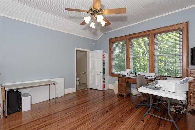 office featuring a ceiling fan, crown molding, wood finished floors, and baseboards