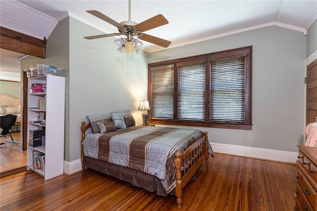 bedroom with baseboards, lofted ceiling, wood finished floors, and ornamental molding